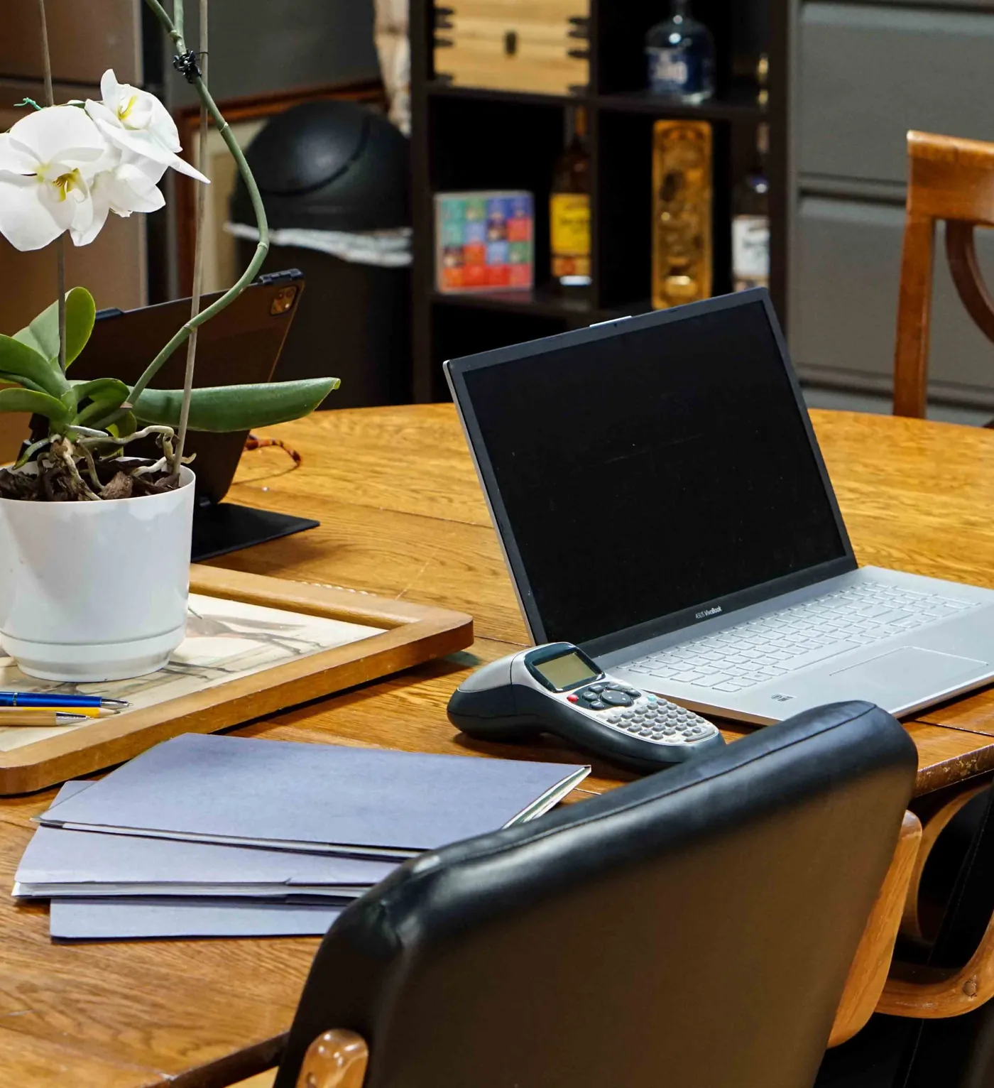 A Brady Management workstation set up with a laptop, client files and paperwork