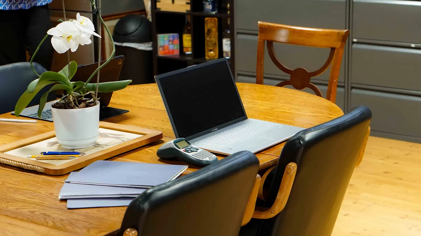 Client paperwork and a laptop on the desk at the Brady Management office in Lawrenceburg, Kentucky